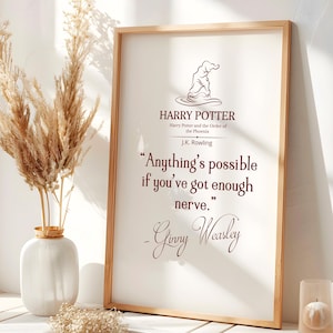 May include: A framed print featuring text from the Harry Potter series. The quote, "Anything's possible if you've got enough nerve," is displayed in a decorative font. The print is in a light wood frame, with a vase of dried flowers and a candle nearby.