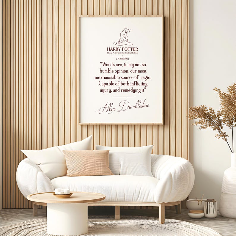 May include: A framed print featuring a quote from Harry Potter by J.K. Rowling. The quote reads: "Words are, in my not-so-humble opinion, our most inexhaustible source of magic. Capable of both inflicting injury, and remedying it." Signed by Albus Dumbledore.