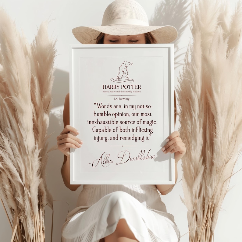 May include: A white framed print with the Harry Potter logo and a quote by Albus Dumbledore. The quote reads, "Words are, in my not-so-humble opinion, our most inexhaustible source of magic. Capable of both inflicting injury, and remedying it."
