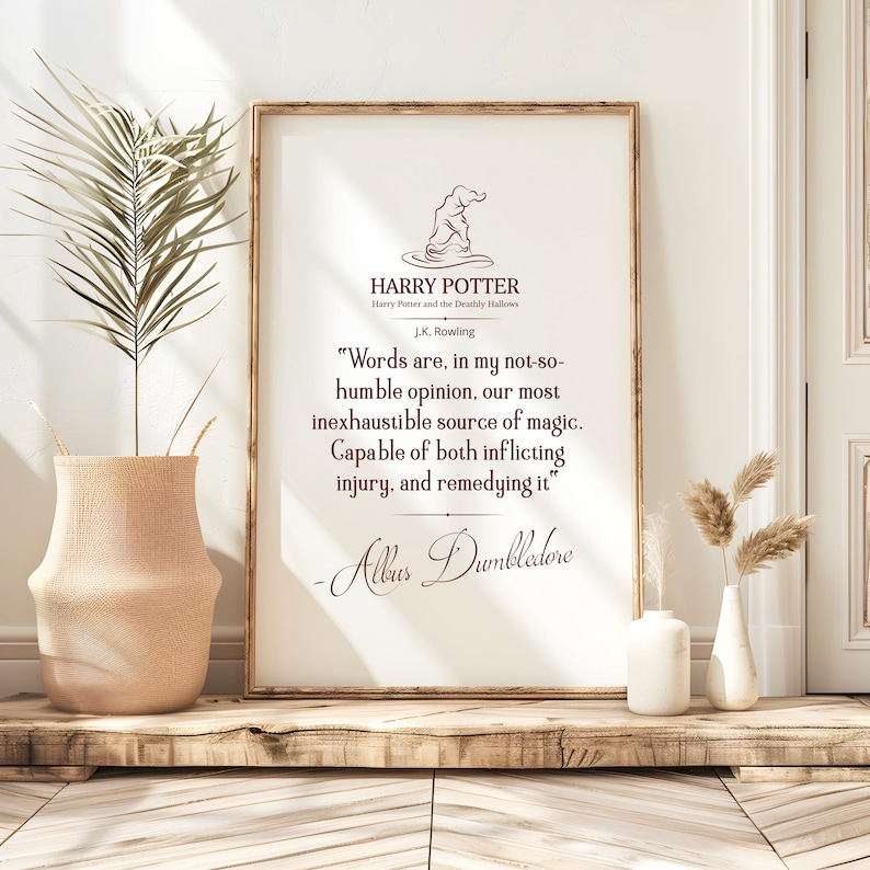 May include: A framed print with a quote from Harry Potter and the Deathly Hallows by J.K. Rowling. The text, attributed to Albus Dumbledore, is in an elegant font. The print is in a brown frame and is set against a neutral background.