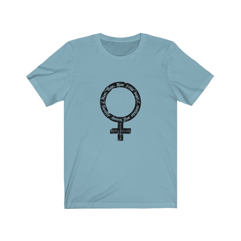 May include: Light blue t-shirt with a black and white graphic of a female symbol with the text "Row, Row, Row your boat, Gently down the stream".