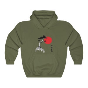 May include: A green hooded sweatshirt with a black and white image of a tree and a red sun. The Japanese text "呼吸する" is printed on the right side of the image.