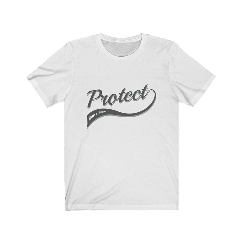 May include: White t-shirt with a gray graphic that says "Protect Roe v. Wade" in a retro-style font.