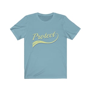 May include: A light blue t-shirt with a yellow curved graphic that says "Protect" with the words "Roe v. Wade" in smaller text underneath.