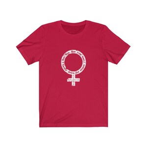 May include: Red t-shirt with a white graphic of a female symbol with the text "Roe, Roe, Roe your boat gently down the stream" around it.