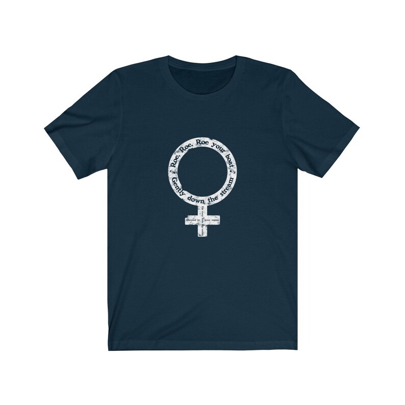 May include: A navy blue t-shirt with a white graphic of the female symbol. The graphic has the text "Row, Row, Row your boat, Gently down the stream" around the symbol.