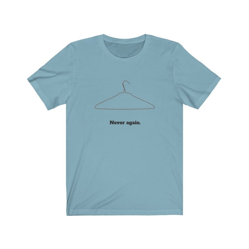 May include: A light blue t-shirt with a wire hanger graphic and the text "Never again."