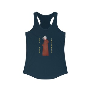 May include: A navy blue tank top with a graphic of a woman in a red robe and a white bonnet. The text "NOT YOUR INCUBATOR" is printed vertically on the right side of the graphic.