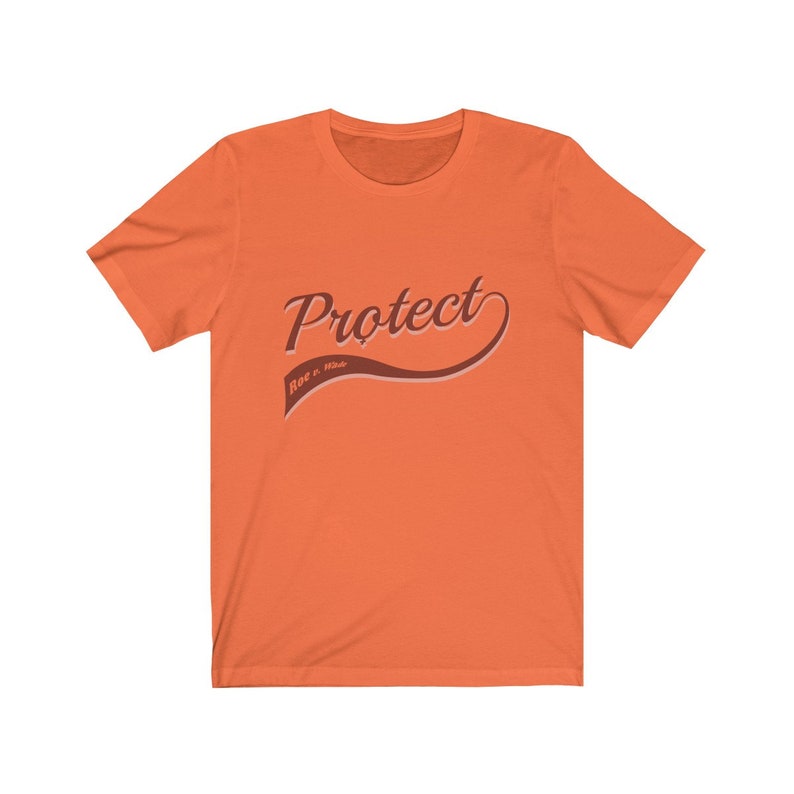 May include: Orange short-sleeved t-shirt with the text "Protect Roe v. Wade" in a brown retro-style font.