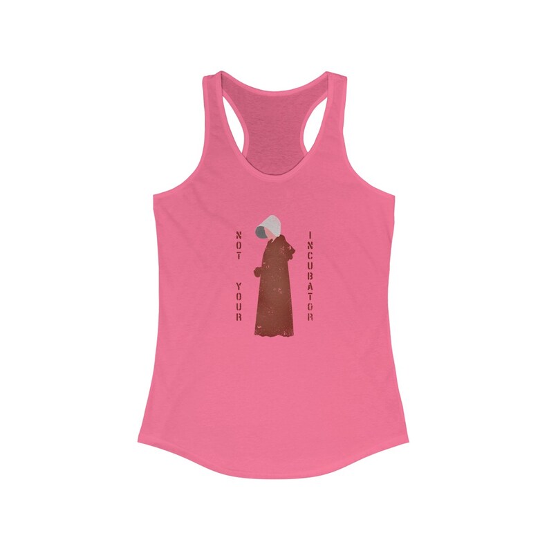 May include: Pink racerback tank top with a graphic of a woman in a red robe and the text "NOT YOUR INCUBATOR" in red.