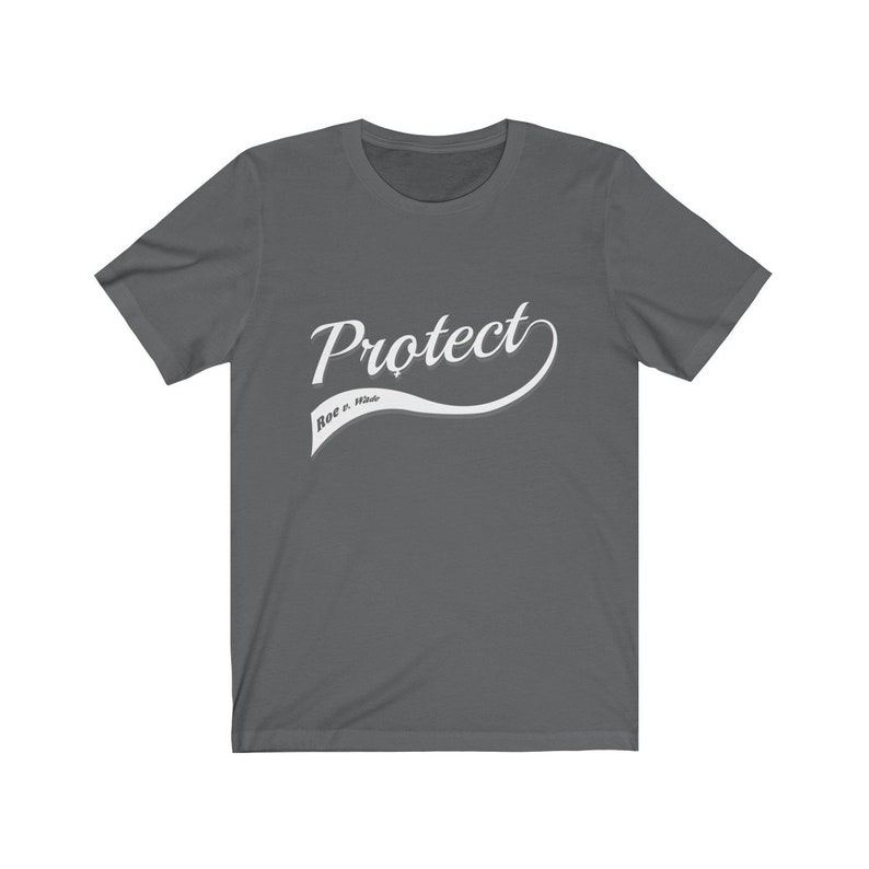May include: A dark gray t-shirt with a white graphic that says "Protect Roe v. Wade" in a stylized font.