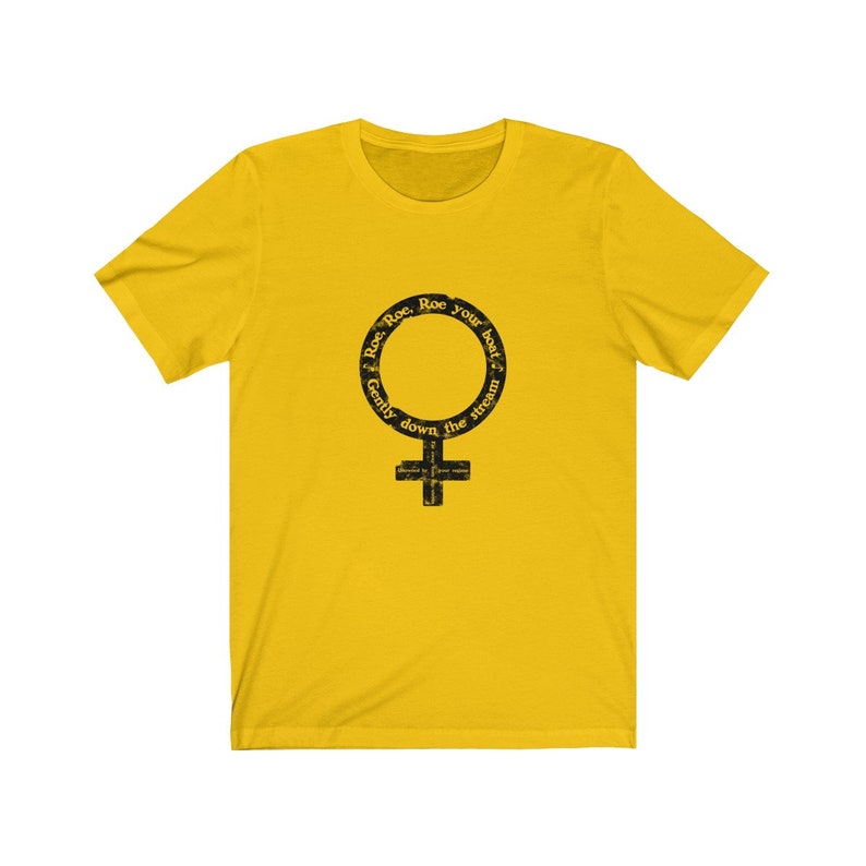 May include: Yellow short-sleeved t-shirt with a black graphic of a female symbol with the text "Roe. Roe. Roe your boat Gently down the stream" around the circle.