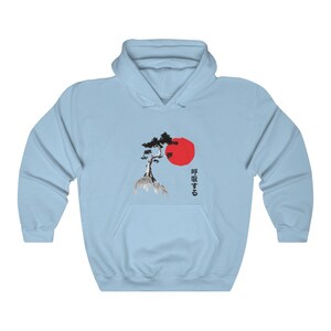 May include: Light blue hoodie with a black and white illustration of a tree and a red sun. The Japanese text "呼吸する" is printed on the hoodie.