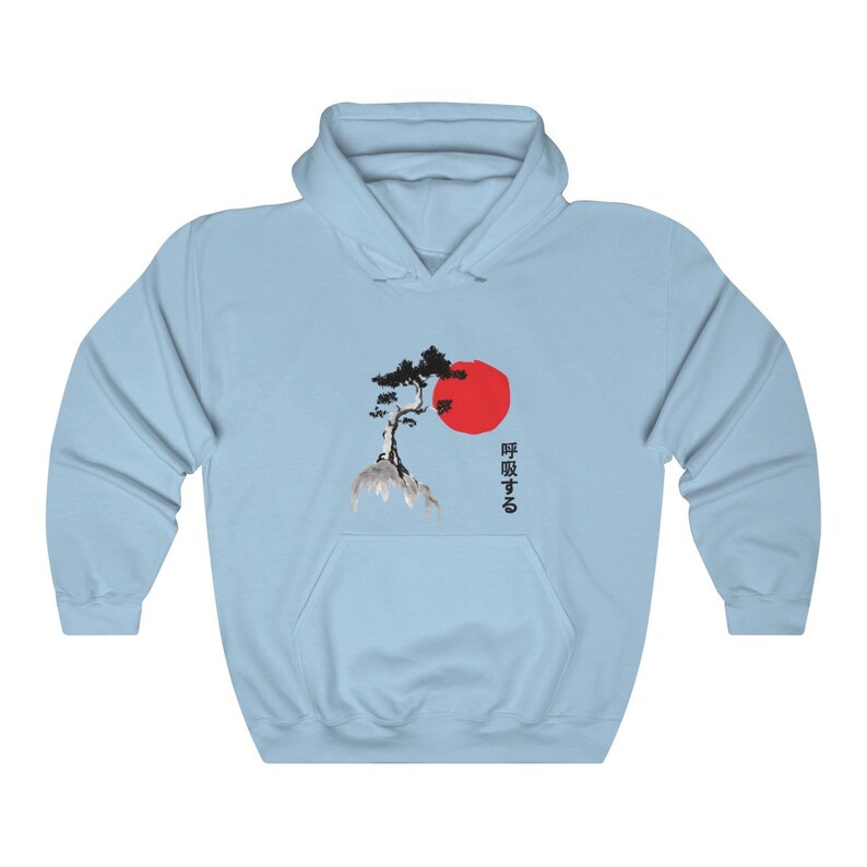 May include: Light blue hoodie with a black and white illustration of a tree and a red sun. The Japanese text "呼吸する" is printed on the hoodie.