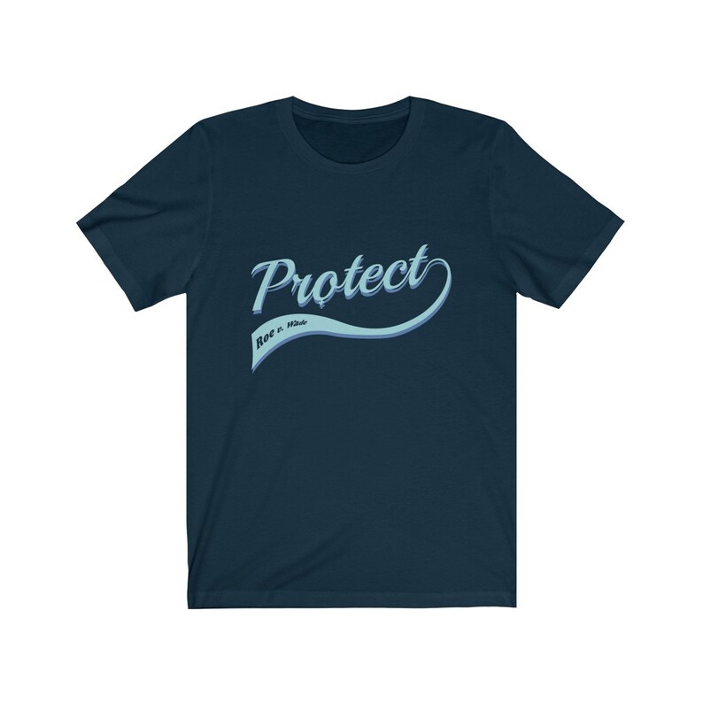 May include: A navy blue t-shirt with a light blue vintage-style graphic that says "Protect Roe v. Wade".