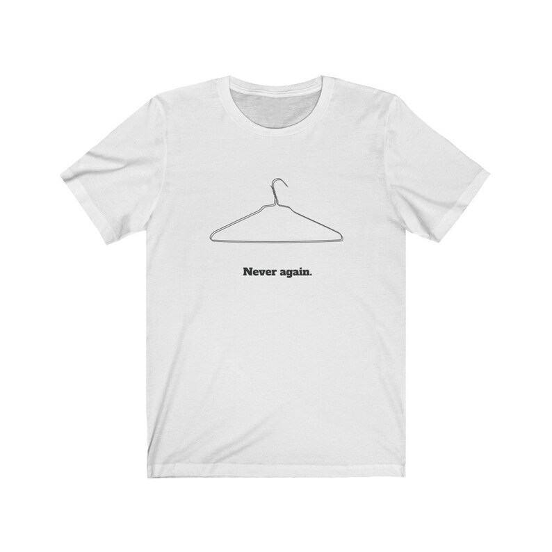 May include: White t-shirt with a black outline of a wire hanger and the text "Never again."