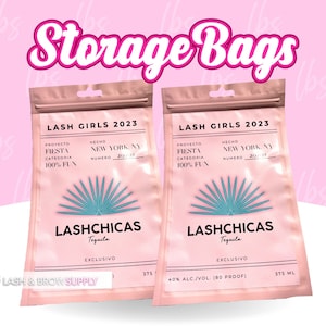 May include: Two pink storage bags with a white label that says "LASH GIRLS 2023" and "LASHCHICAS Tequila" with a palm tree design. The bags are 375 ml and 40% alc./vol. (80 proof).
