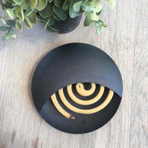 Mosquito coil holder, in black metal. Modern, metal mosquito coil holder, Contemporary coil holder. Futuristic mosquito coil holder