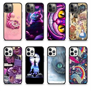 May include: Eight phone cases featuring designs inspired by Alice in Wonderland. The cases showcase the Cheshire Cat in various poses and scenes, with vibrant colors and whimsical illustrations. Each case has a black border.