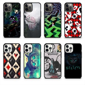 May include: A collection of phone cases featuring designs inspired by Alice in Wonderland. Designs include the Cheshire Cat, playing card patterns, and scenes from the story. Cases are black with various colorful graphics.