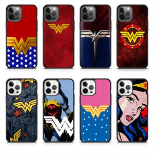 May include: Collection of eight phone cases featuring Wonder Woman designs. Cases showcase the iconic "W" logo, stars, and comic book art in red, blue, pink, and gold. Each case has a black border and is designed for a smartphone.