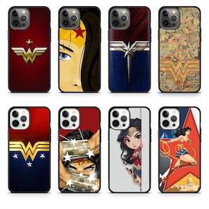 May include: Collection of phone cases featuring Wonder Woman designs. The cases showcase various images, including the Wonder Woman logo, comic book art, and illustrations of the character. The cases have black borders and are in various colors.