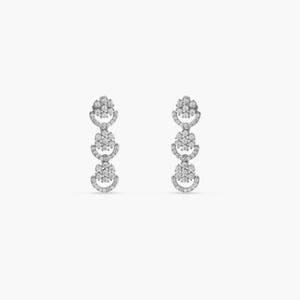 May include: A pair of silver dangle earrings with three tiers of round, sparkly, white stones.