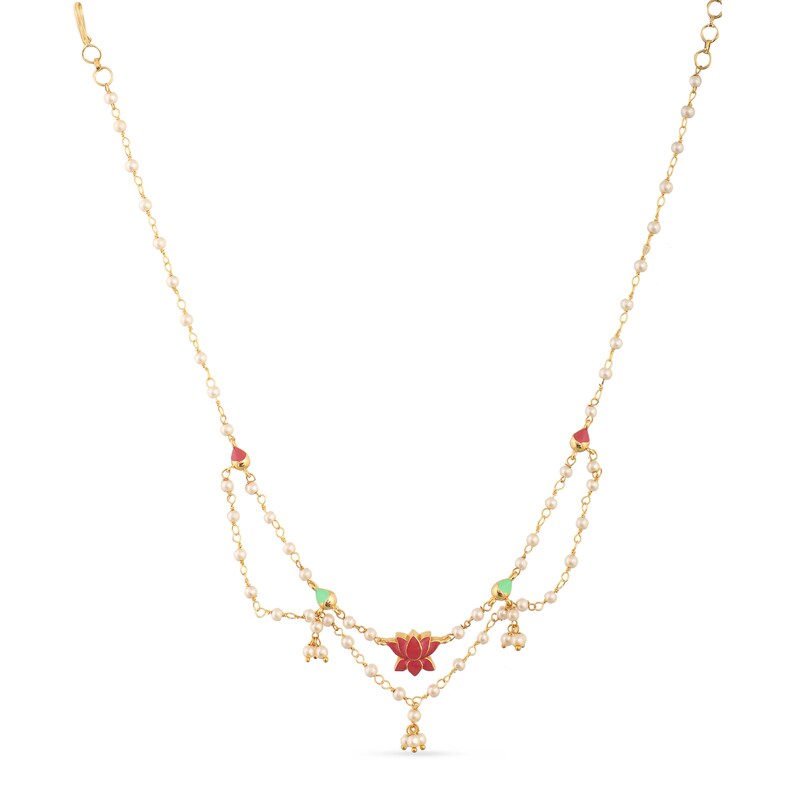 May include: A gold necklace with a red and green lotus flower pendant and white pearl accents.