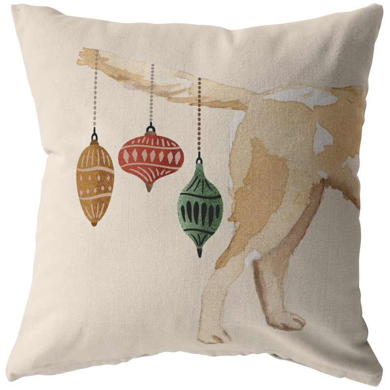 May include: A watercolor illustration of a dog's rear end with three Christmas ornaments hanging from its tail. The ornaments are red, green, and gold.