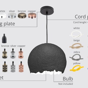 May include: A black pendant light with a round, textured shade. The light has a black cord and a ceiling plate with options for black, white, silver, bronze, and copper finishes. The cord is available in a variety of colors, including white, black, beige, gray, zebra, red, yellow, and blue. The cord length is 3.3 feet or 1 meter. The bulb is not included.