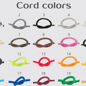 May include: Twenty different colors of cord, each tied in a simple knot, numbered 1 through 20.