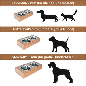 May include: Two stainless steel dog bowls on a wooden stand. The stand is 14 inches long, 6 inches wide, and 3 inches tall. The bowls are 5 inches in diameter. The stand is made of natural wood and has a light brown finish.