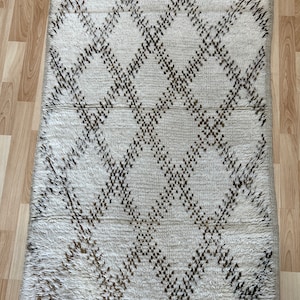 Traditional Moroccan tribe berber design hand made woolen rug.