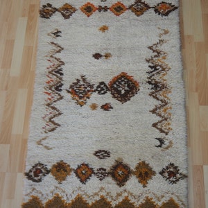 Traditional Moroccan tribe berber design hand made woolen rug.