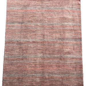 Contemporary design hand made woolen rug. 290x230cm.