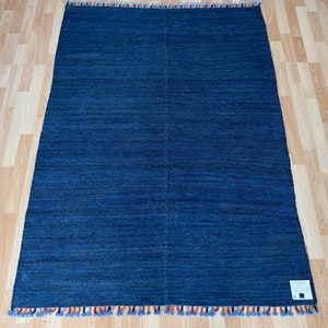 Plain ubrush contemporary flat woven wool kilim.