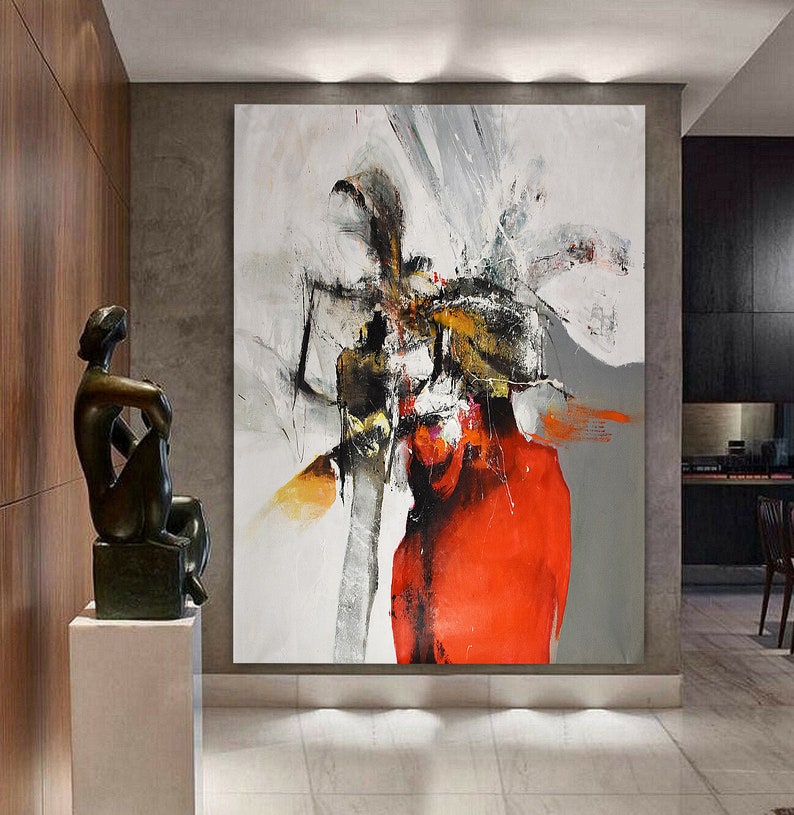 Może przedstawiać: Abstrakcyjne malarstwo z odważnymi pociągnięciami czarnej, białej, szarej i czerwonej farby. Obraz przedstawia duży, centralny czerwony kształt otoczony mniejszymi czarnymi i białymi kształtami.