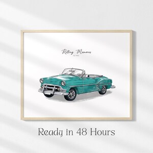 May include: Watercolor illustration of a vintage teal convertible car. The artwork is framed in a light wood frame and features the text "Rolling Memories" and "Ready in 48 Hours".
