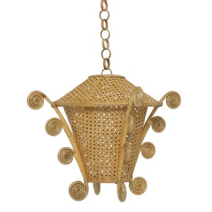 May include: A woven rattan pendant light with a geometric design and a chain hanging from the top. The light has a natural beige color and features decorative swirls around the bottom.
