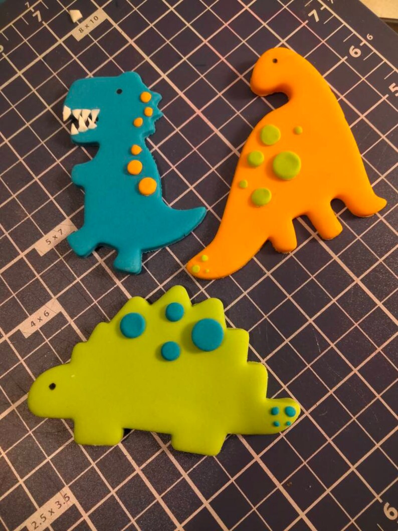 Set of 3 plus number for age. Dinosaur edible cake toppers