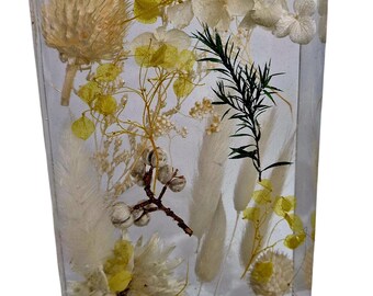 Ornimental resin block with dried real flowers. 15 cm long x 10 wide and 4.5cm deep.