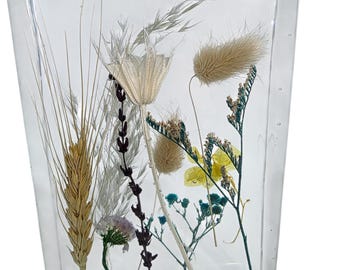 Ornimental resin block with dried real flowers. 15 cm long x 10 wide and 4.5cm deep.