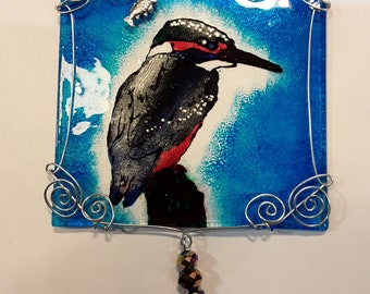 Hand painted glass kingfisher suncatcher with wirework surround and silver fish and feather charms