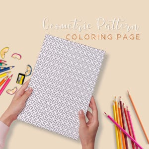 May include: A black and white geometric pattern coloring page with a title that reads "Geometric Pattern Coloring Page". The page is being held by hands and surrounded by colored pencils and pencil shavings.