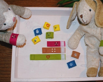 Reusable play patches made of natural felt with embroidered motifs for creative play, doctor's case accessories for children