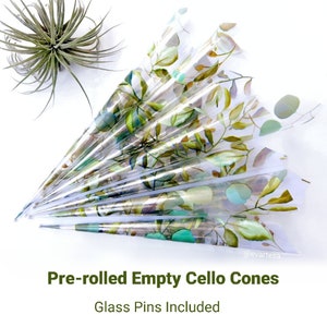 May include: Pre-rolled empty cello cones with a leafy green watercolour design. Glass pins are included. @evartecsa