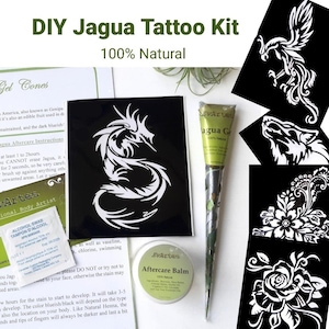 May include: A DIY Jagua tattoo kit containing a cone of Jagua gel, a round tin of aftercare balm, an alcohol swab, and several black sheets with white stencil designs including a dragon, a phoenix, a wolf, and floral patterns with text.