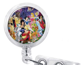 May include: A clear, round retractable badge reel featuring a colorful image of Disney characters, including Mickey Mouse, Snow White, and Cinderella. The reel has a silver clip and a clear plastic strap for attaching to clothing or accessories.