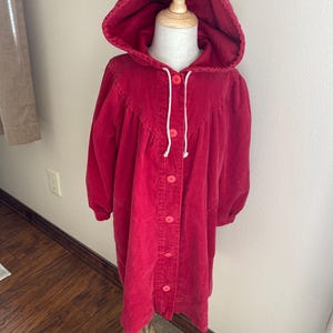 Girls red corduroy coat with lining. Hood and pockets. Size 6, Vintage 1990. Used