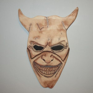 The Grabber mask wall plaque